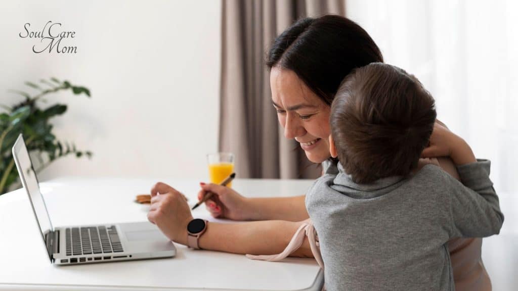Child hugging mom with laptop - Balancing Motherhood and Work