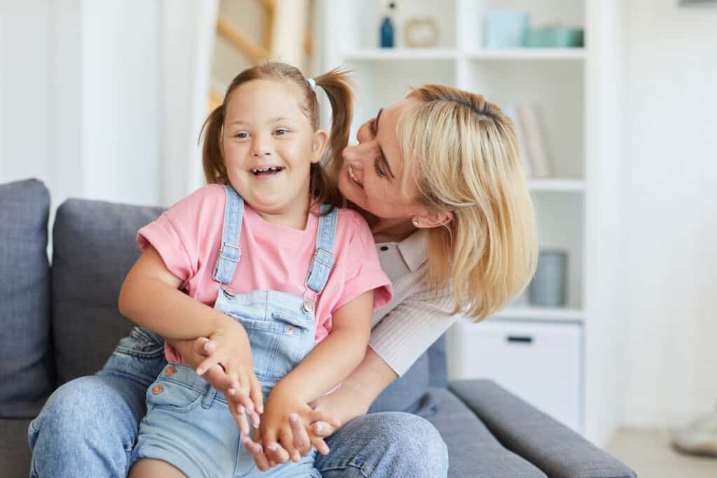 Special Needs Mom Laughing With Her Daugher