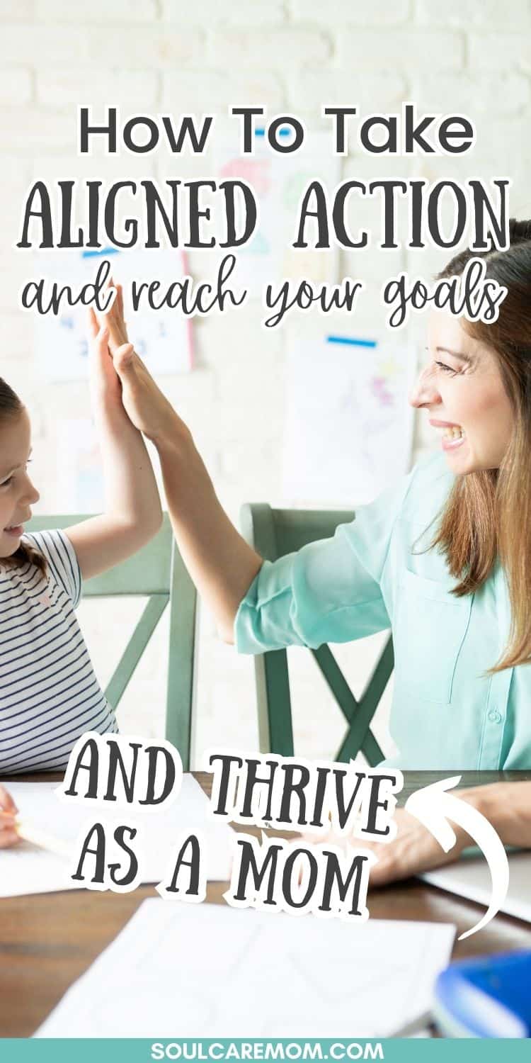 Mom and child high five as mom discovers goal setting tips that are helping her to take aligned action and achieve her goals